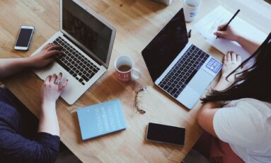 Person working from home as a Virtual Assistant, using digital tools to manage tasks.